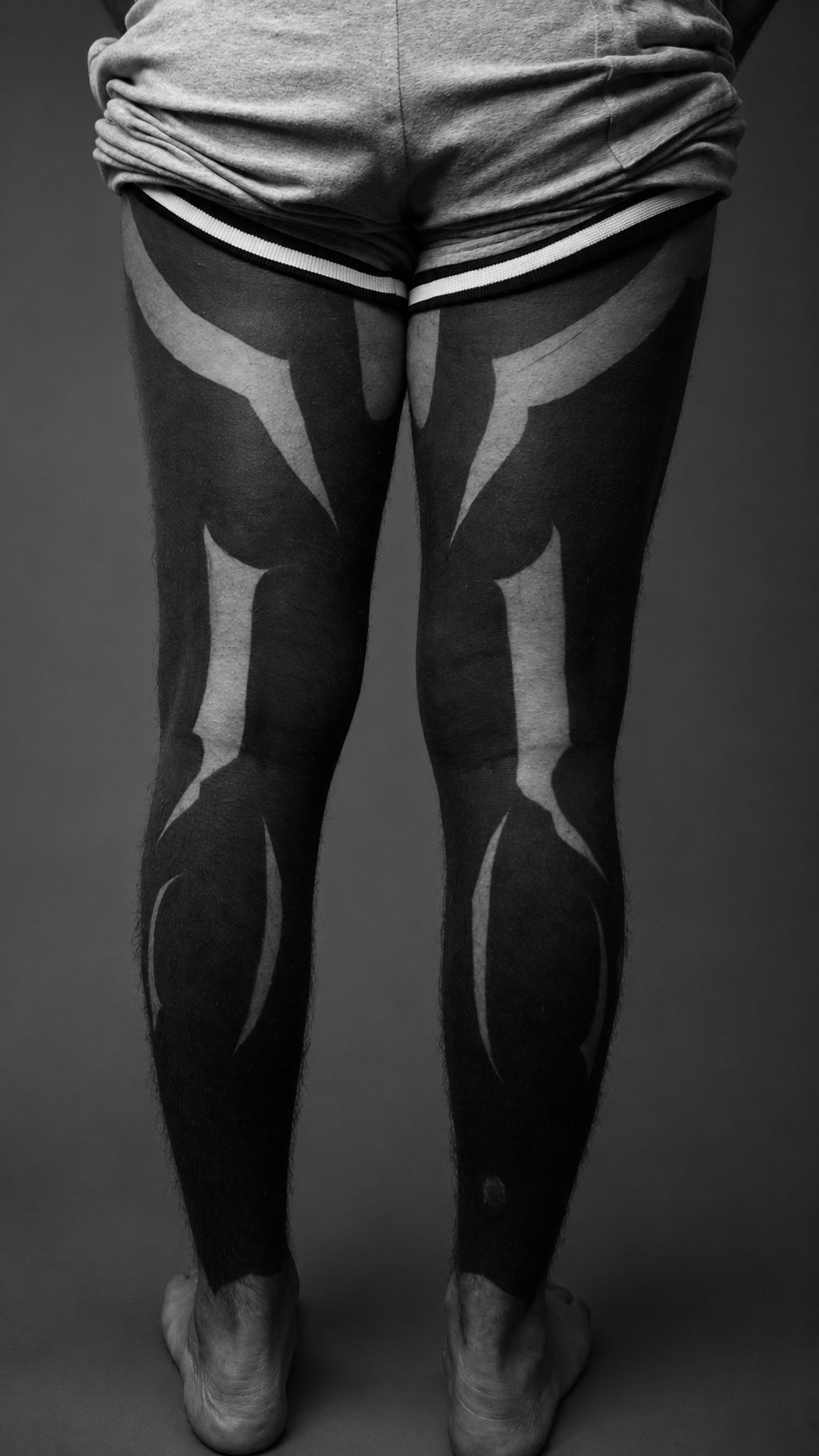Freehand blackout leg tattoo, back view, Subleink Tattoo Shop Art Gallery, Panama City