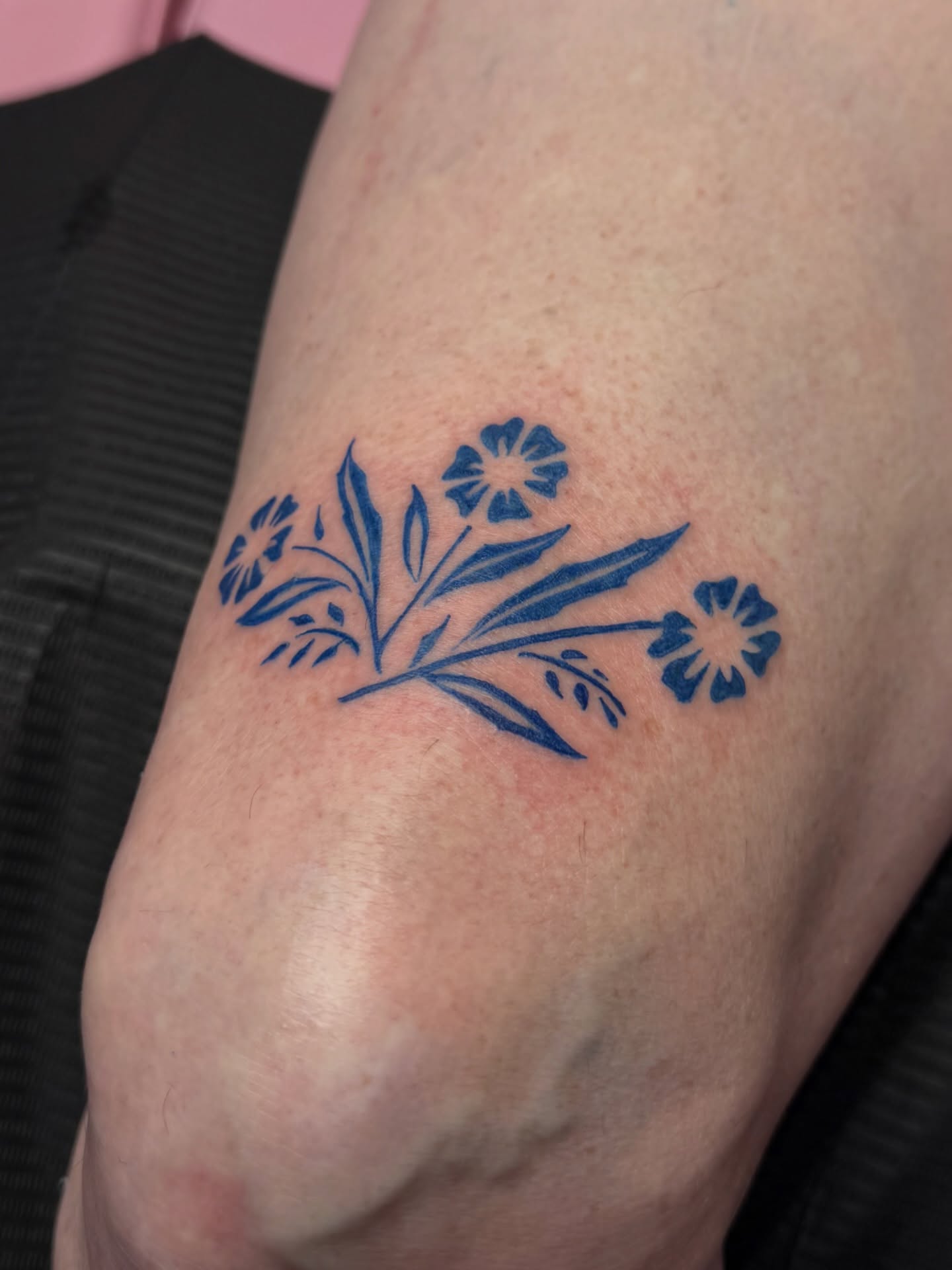 Fine line botanical style tattoo example by Nova